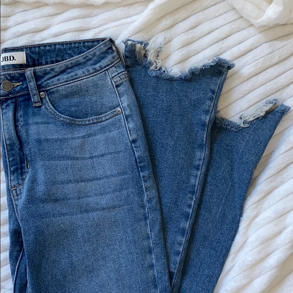 light blue straight leg jeans w/ distressed bottom